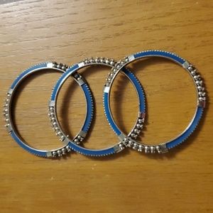 Set of three turquoise-tone and silvertone bangle bracelets.